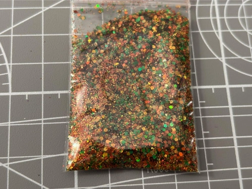 Glitter 5grs  mix naranjos con verde